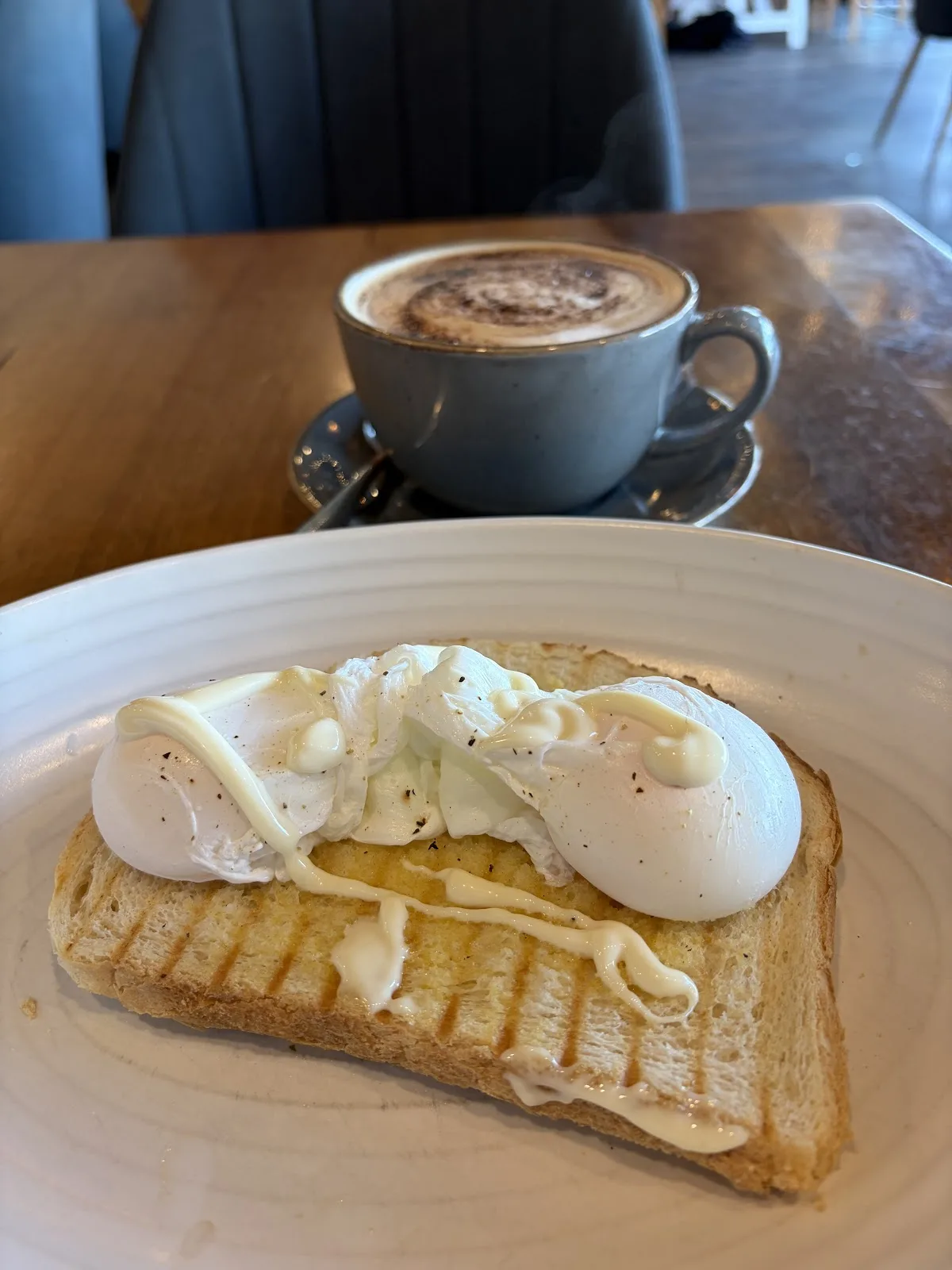 Poached eggs on toast with a cappuccino at Isla Bay